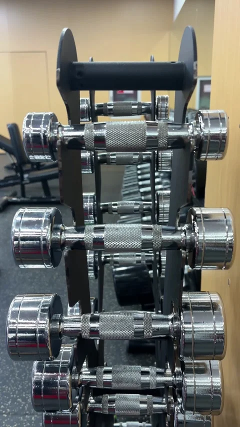 Vertical 4K Close Up of Hand Returning 3kg Dumbbell Stock Footage 329336537