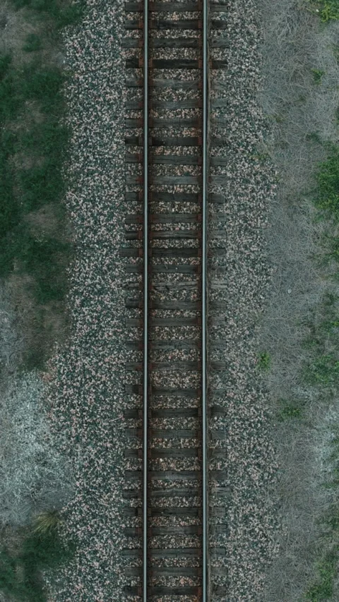 Vertical 4K Drone Shot of Railroad Tracks Top Down Aerial Moving Forward Stock Footage 334243811