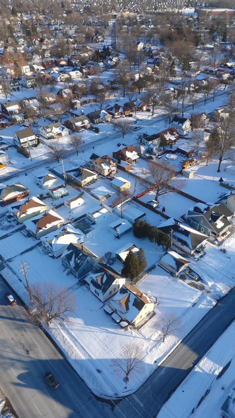 Vertical 4K Drone Snow Covered Suburban Homes Residential area Winter Video stock 327932382