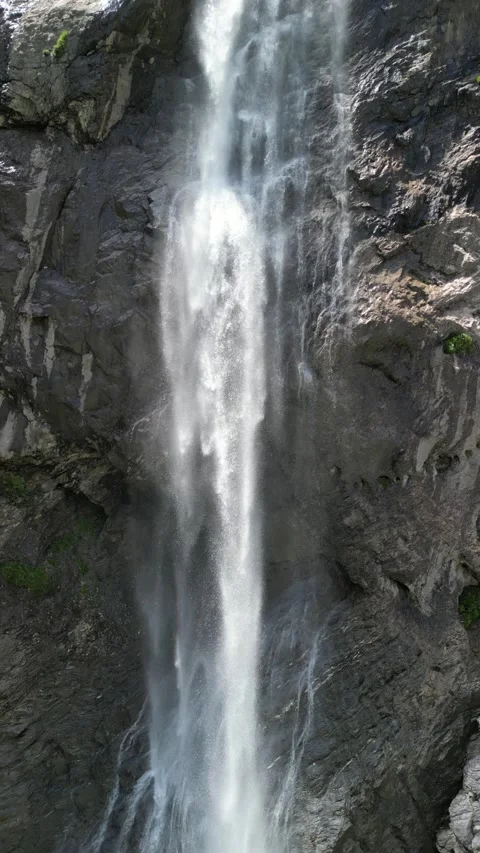 Vertical 4K Drone View of a Alpine Waterfall Video stock 328706103