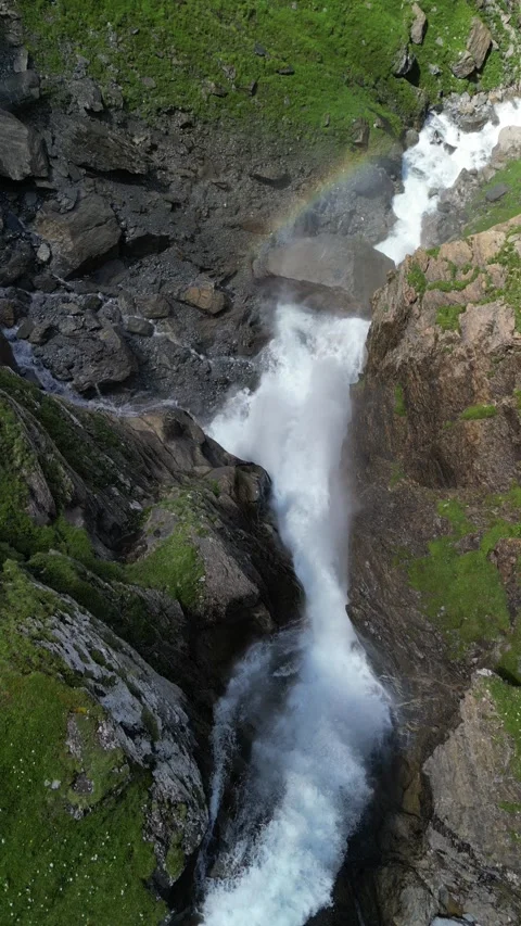 Vertical 4K Drone View of a Double Alpine Waterfall in Lush Green Forest Video stock 328706084