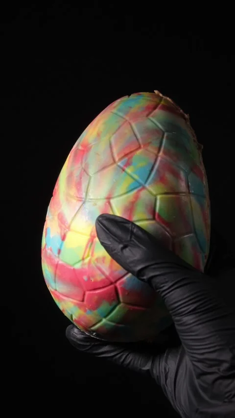 Vertical 4K Easter Egg in Black Glove Stock Footage 332508638