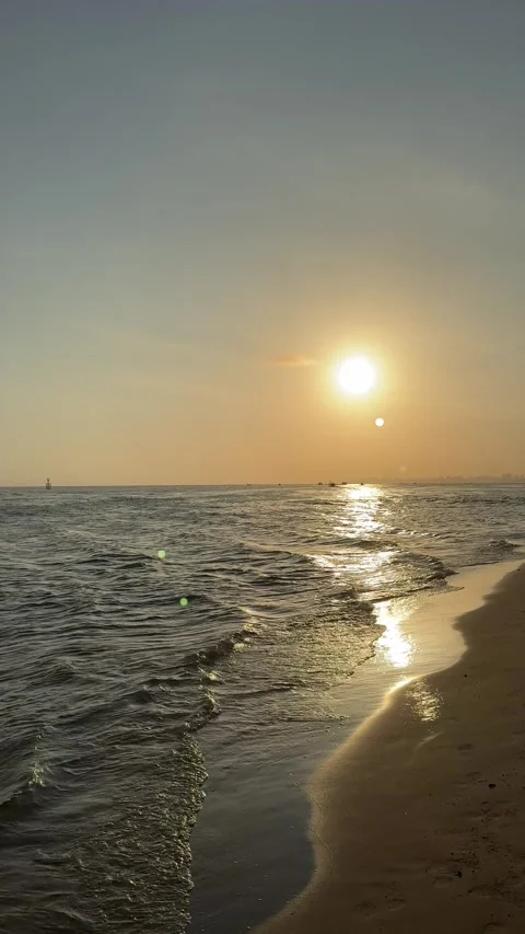 Vertical 4K Golden Sunset Waves on Sanya Bay Beach Stock Footage 330987540