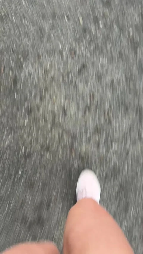 Vertical 4K handheld POV of aesthetic morning routine walking in pink sneakers. 스톡 동영상 337962612