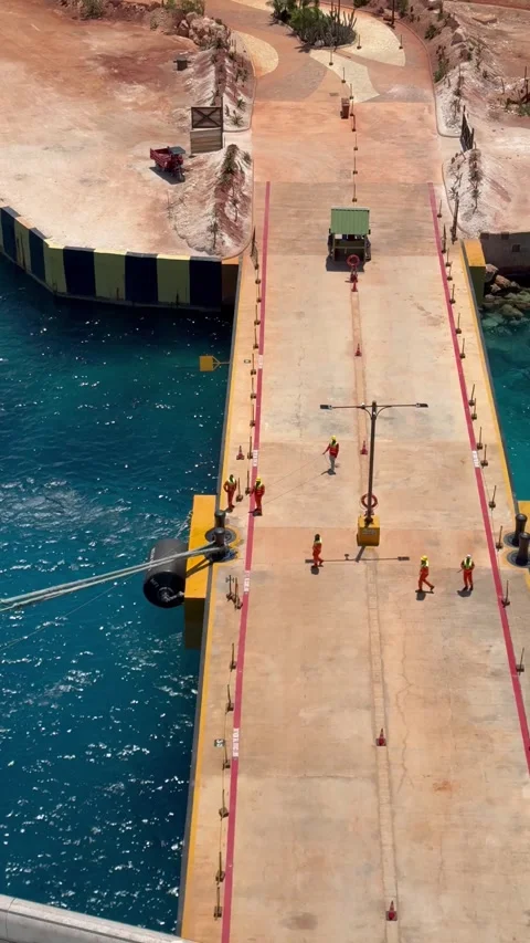 Vertical 4K High Angle Of Port Workers Pulling Mooring Rope In Cabo Rojo Stock-Footage 335480175