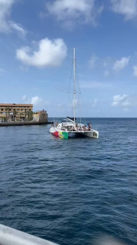 Vertical 4K Large Catamaran Boat Navigating Near Pontoon Bridge Curacao Stock-Footage 335281054