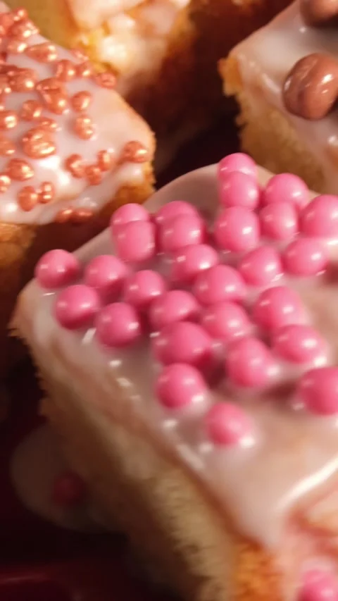 Vertical 4K Macro Top Down View of Rotating Assorted Cake Toppings Stock Footage 333320187