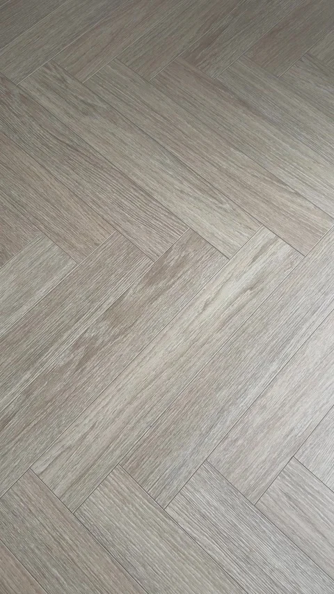 Vertical 4K - Natural Oak Herringbone Parquet Floor Texture Grey Beige Stock Footage 345431518