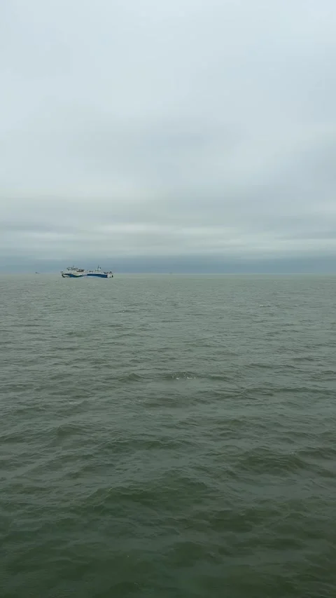 Vertical 4K Passenger Ferry Transporting Travelers in Qiongzhou Strait Stock-Footage 332036426