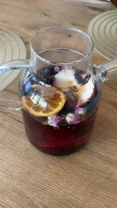 Vertical 4K Pouring Maple Syrup into Glass Teapot Winter Fruit Tea B-Roll⁠ Stock Footage 347098247