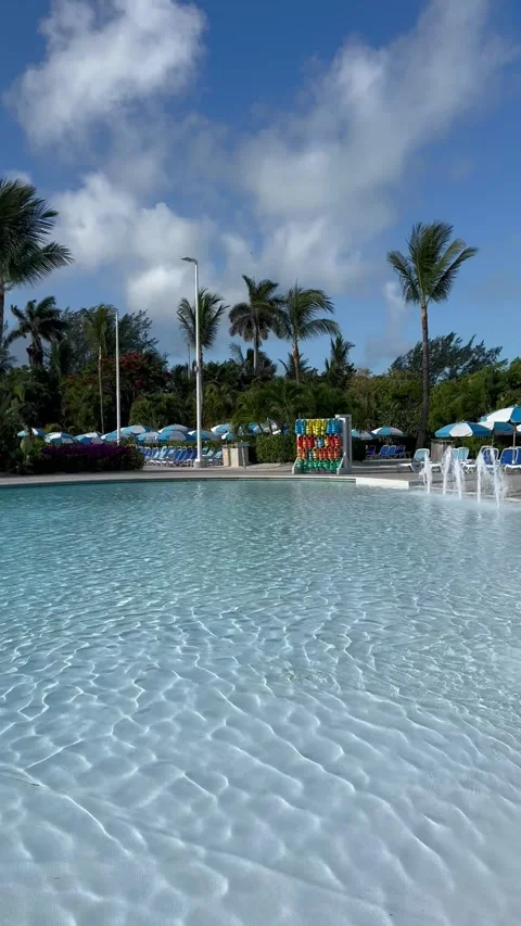 Vertical 4K POV Diagonal Panning Shot Over Empty Cruise Resort Swimming Pool Stock Footage 335549446