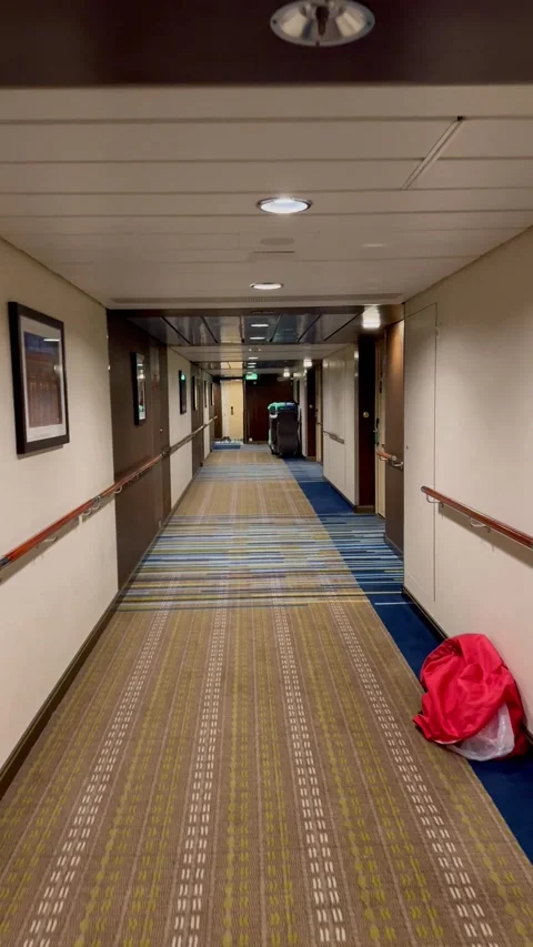 Vertical 4K POV Walking Down Luxury Cruise Ship Suites Corridor Stock Footage 335387097