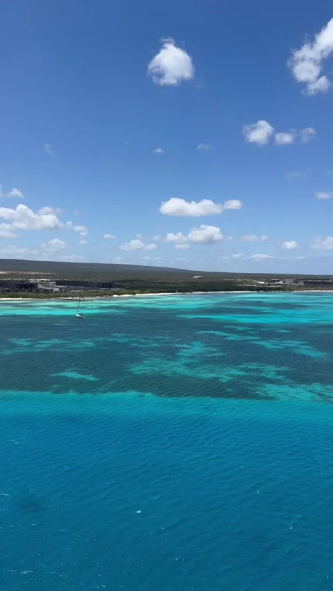 Vertical 4K POV Walking Past Cruise Ship Window Revealing Turquoise Ocean Stock Footage 335480216