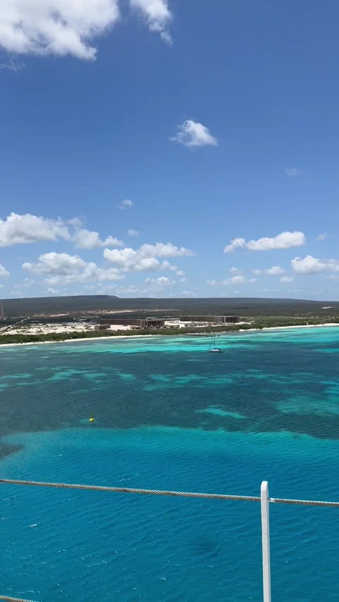 Vertical 4K POV Walking Past Cruise Ship Window Revealing Turquoise Ocean Vídeos de archivo 335480285