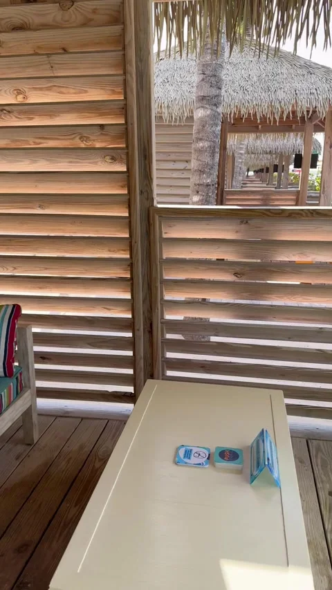 Vertical 4K POV Walking Into Private Beach Cabana Revealing Sea View Stock Footage 335549417