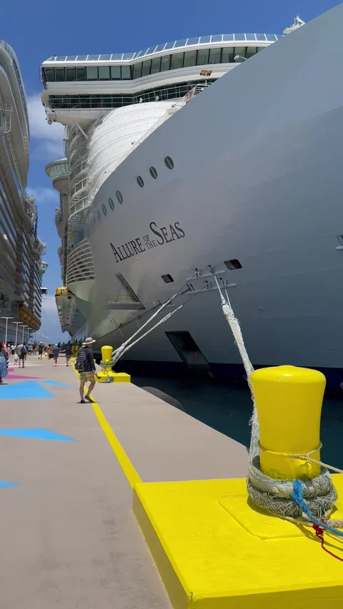 Vertical 4K POV Walking Under Cruise Ships Tilting Up To Allure And Wonder Of Th Stock Footage 335548475