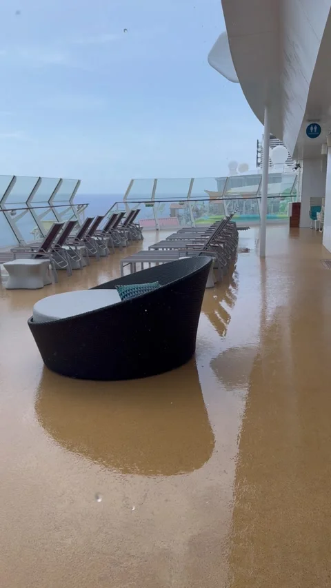 Vertical 4K Rain Pours On Empty Cruise Ship Open Upper Deck With Sun Loungers Vídeos de archivo 335474738