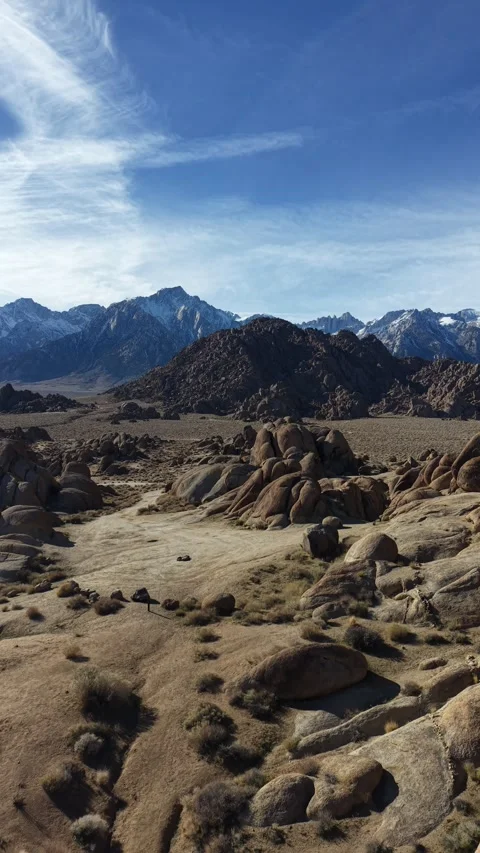 Vertical 4K Real-Time Drone Descending Over Snowy Alabama Hills Camping Tent Stock Footage 324300991