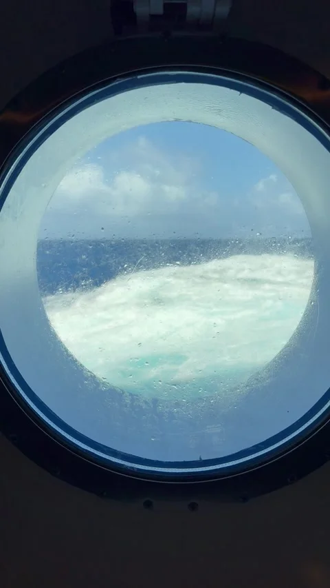 Vertical 4K Rough Ocean Waves Seen Through Cruise Ship Porthole Window Stock Footage 335162046