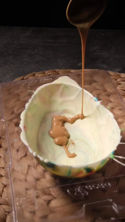 Vertical 4K Speculoos Pour into Egg Mould Stock Footage 332508630