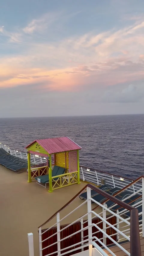 Vertical 4K Static Cruise Ship Deck View At Moody Sea Sunset Vídeos de archivo 335111875
