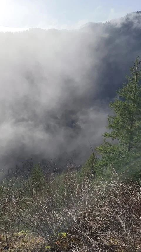 Vertical 4K static footage of slow cloud movement drifting through valley Stock Footage 325291741
