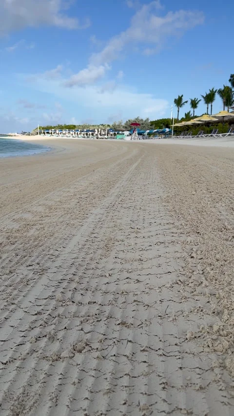 Vertical 4K Static View Of Tire Tracks On Groomed Empty Beach In CocoCay Stock-Footage 335549416