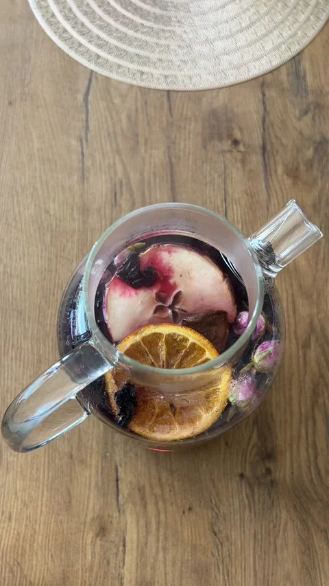 Vertical 4K Top Down Close Up Brewed Winter Fruit Tea in Glass Teapot B-Roll⁠ Stock-Footage 347098256