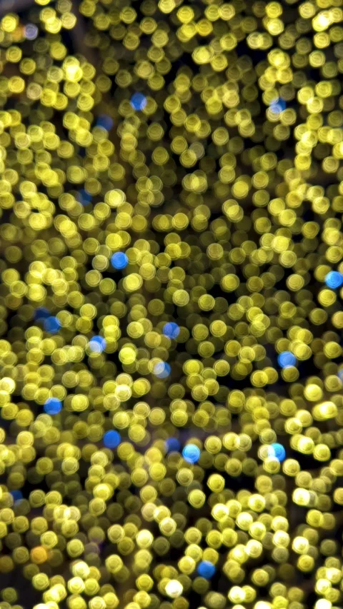 Vertical 4K video. Blurred background with yellow and blue bokeh lights 库存影片 340427561