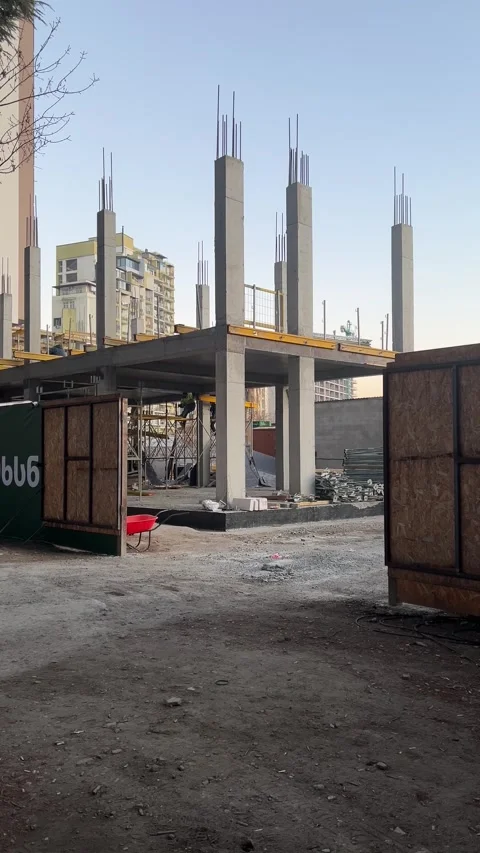Vertical 4K video. Builder constructs building Stock Footage 297421184