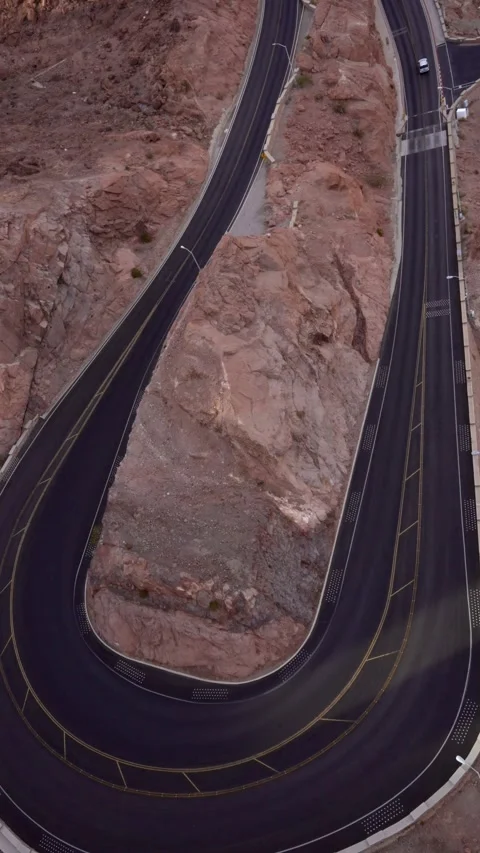 Vertical 4K video of a car driving along a perfectly paved American road Stock Footage 342061221