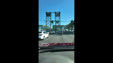 Vertical 4K video driving on I-5 bridge toward Portland, OR over Columbia River Stock Footage 314372241