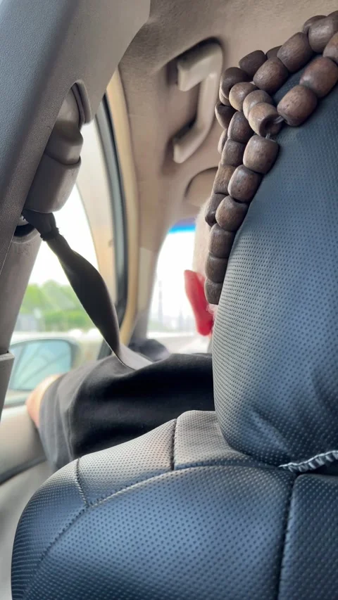 Vertical 4K video from inside car. Back view. Driver of car is driving Stock Footage 279043622