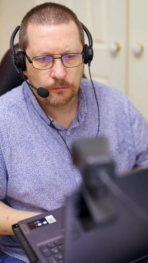 Vertical 4K video of man speaking on video call at home Stock Footage 329358355