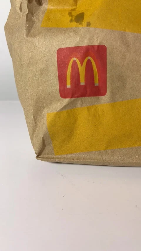 Vertical 4K video. Paper bag with red McDonald's logo Stock Footage 300906724