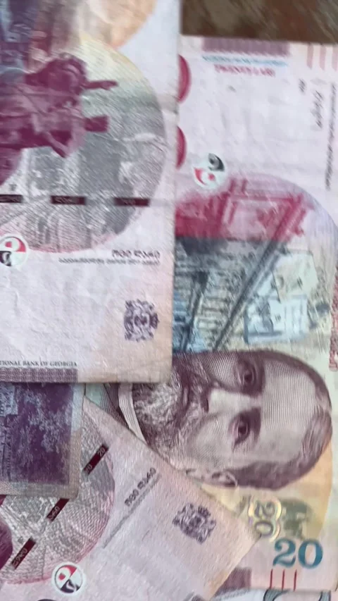 Vertical 4K video. Top view. Paper bill. 20 GEL of Georgia. Twenty lari Stock Footage 269246669