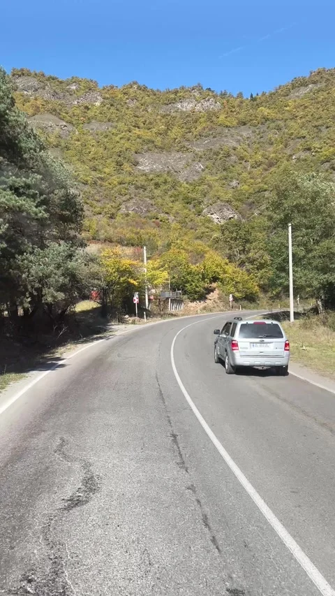 Vertical 4K video. View from taxi car window on mountain, highway Stock Footage 306552612