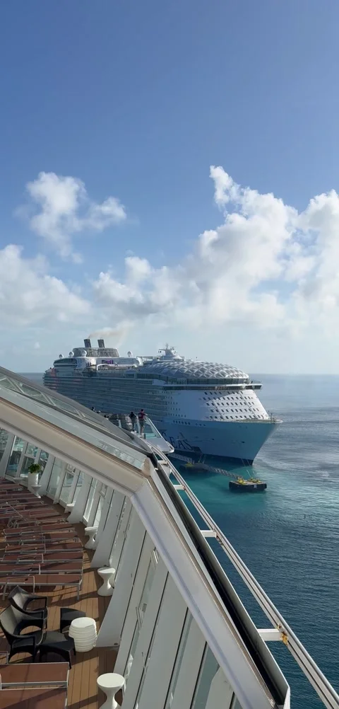 Vertical 4K View From Open Deck Looking Back At Distant Wonder Of The Seas Stock Footage 335550385
