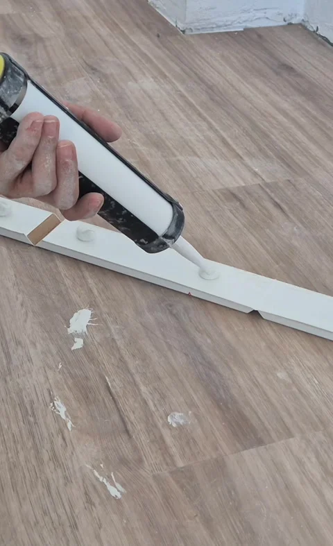 Vertical 9 16 Glue Gun Skirting Board Application Stock Footage 338400587