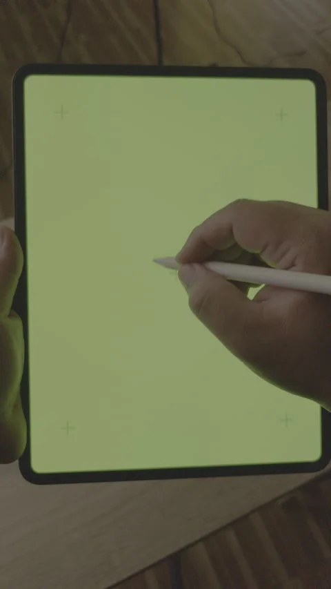 Vertical 9:16 - Close up hand using stylus pen on green screen tablet, LOG Stock Footage 331001246