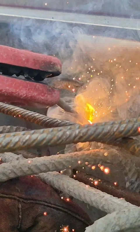 Vertical 9:16 Extreme Close-up of Welding Rebar at Construction Site Stock Footage 331161874