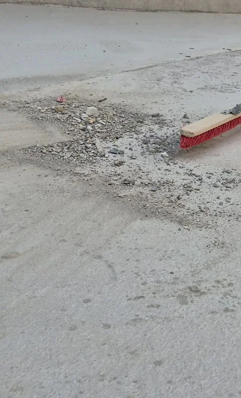 Vertical 9:16: Final Cleanup of Construction Site with Broom Stock-Footage 342527115