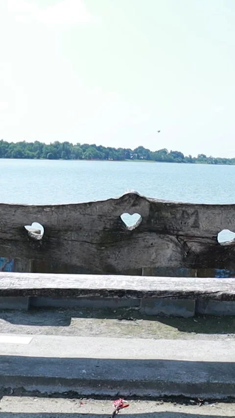 Vertical 9:16 Romantic Concrete Bench with Heart Cutouts at Palic Lake 스톡 동영상 333554491