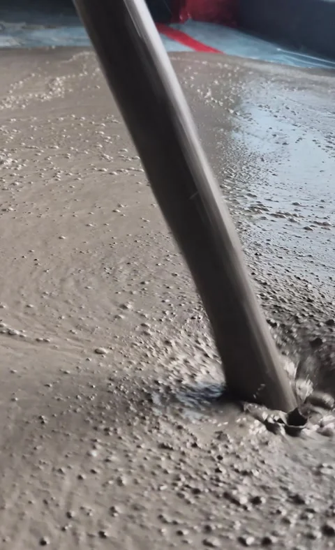 Vertical 9:16: Side View of Pouring Liquid Screed Concrete Stock Footage 342621351