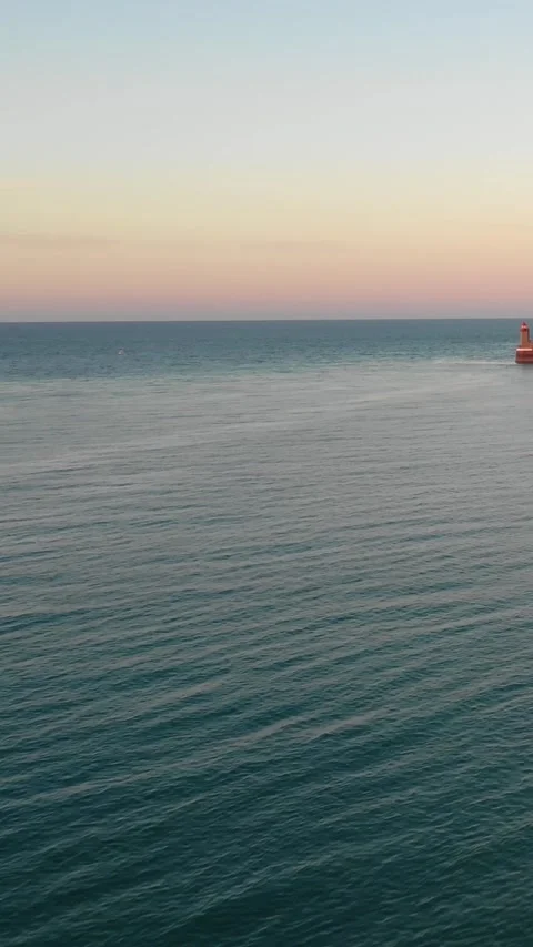 Vertical 9:16 video showing a tranquil seascape at sunset in Fecamp, Normandy Stock Footage 346663071