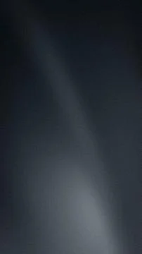 This vertical abstract background features a dark gray black color gradient w Illustrazione stock