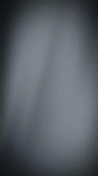 This vertical abstract background features a smooth gradient of dark gray, me Stock Illustration