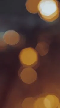 Vertical abstract composition of warm golden bokeh light orbs glowing softly  Stock Photos