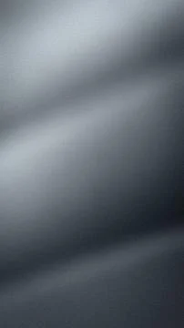 This vertical abstract gradient wallpaper features a smooth blend of gray sil Illustrazione stock