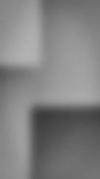 Vertical abstract grainy background in grey, silver and charcoal tones Stock Photos